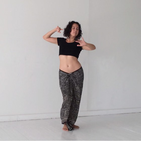 Laurana Wong - Habibi Dah (Nari Narain) - She arches slightly, arms raised at shoulder level, the undulations of her dance showing the curve in her side