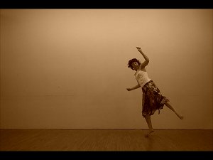 Laurana Wong - This One's for the Seniors - She kicks back and flies, weightless in the moment, the sepia tone matching the music