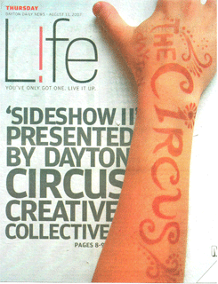 The words "The Circus" are tatooed in henna across a forearm that vertically spans the page; The Sideshow 2 Dayton Daily News Life Cover Story