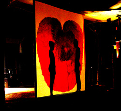 Laurana Wong & Adam Elfers - 1+1=1 - The two silhouettes face off inside the bleeding heart